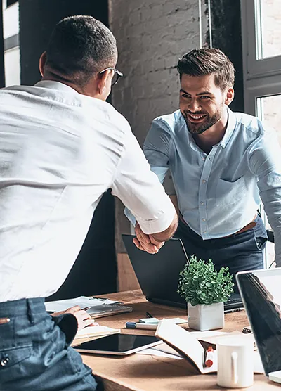 an accountant shaking hand with a client to start a cfo services consultation at simplify my numbers